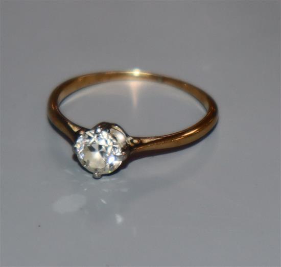 A yellow metal and solitaire diamond ring, size M.